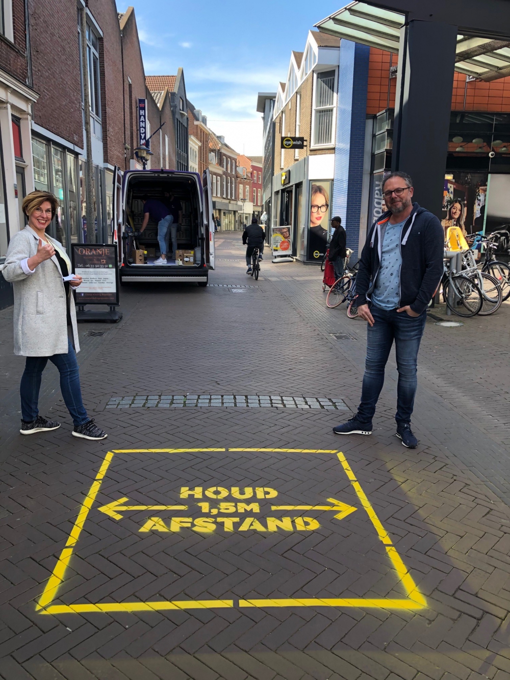 Centrummanagement Schiedam spuit gele verf op straat